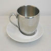 Stainless steel cup with porcelain saucer