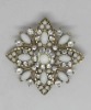 rhinestone encrusted flower brooch