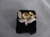 Gold napkin ring with aluminum flower