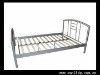 metal bed with wooden slate