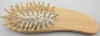 Wooden hair brush with massaging function