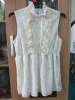 Beautiful sleeveless lace blouse with frills